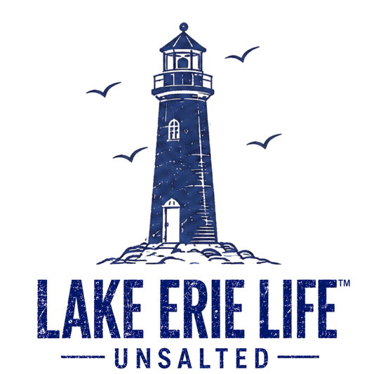 A dark blue graphic logo featuring a lighthouse illustration with seagulls and the text 'LAKE ERIE LIFE UNSALTED' on a plain white background.