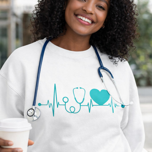 A confident nurse styled in a cozy white sweatshirt with a minimalist heartbeat and stethoscope design, representing care, compassion, and pride in the nursing profession.