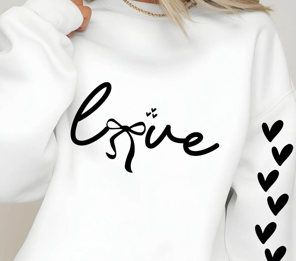 White sweatshirt with 'love' printed on it, featuring a heart design.