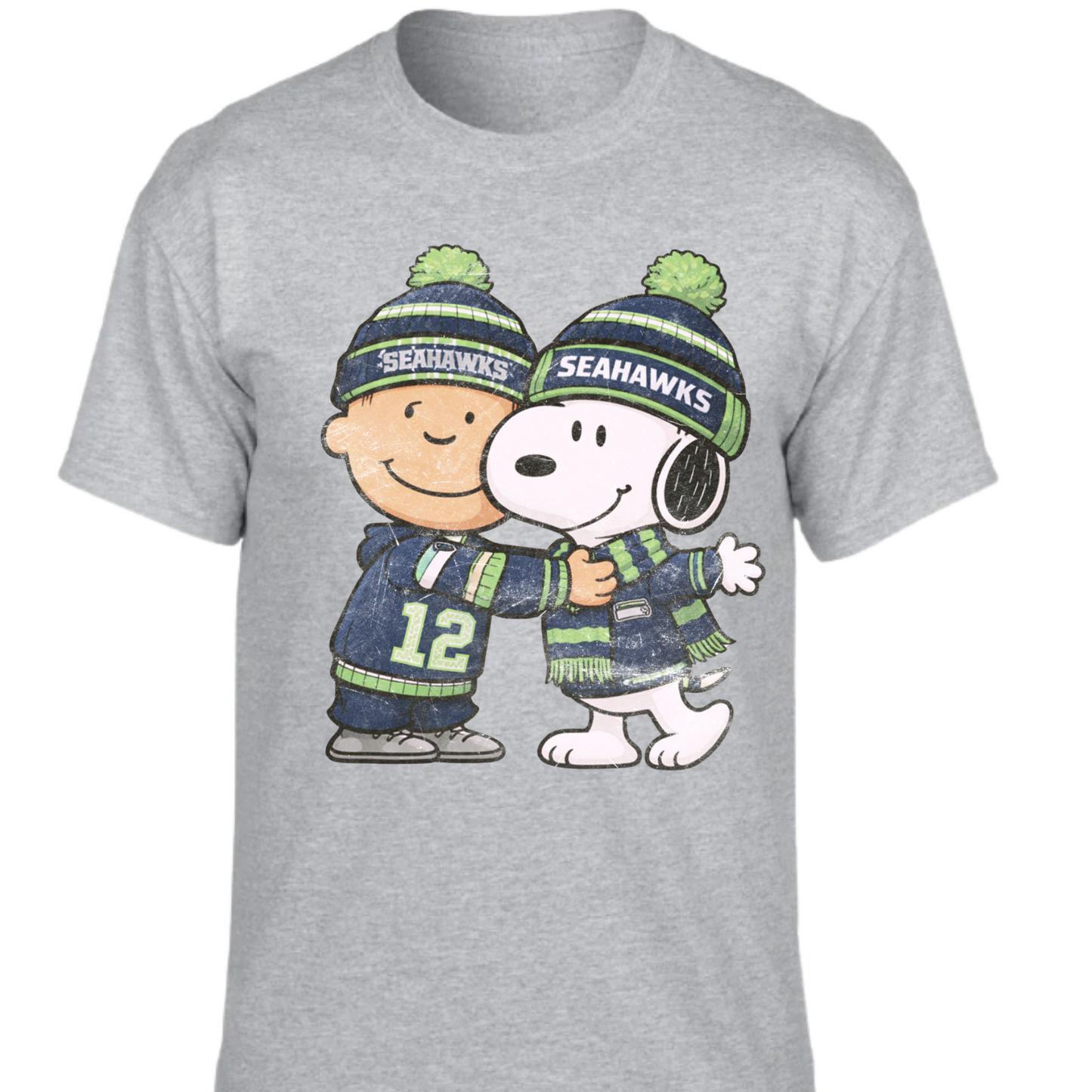 Gray t-shirt with Charlie Brown and Snoopy characters wearing Seahawks-themed clothing on a white background